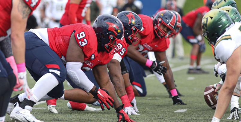 Huskies edge Cardinals 21-20 in season finale